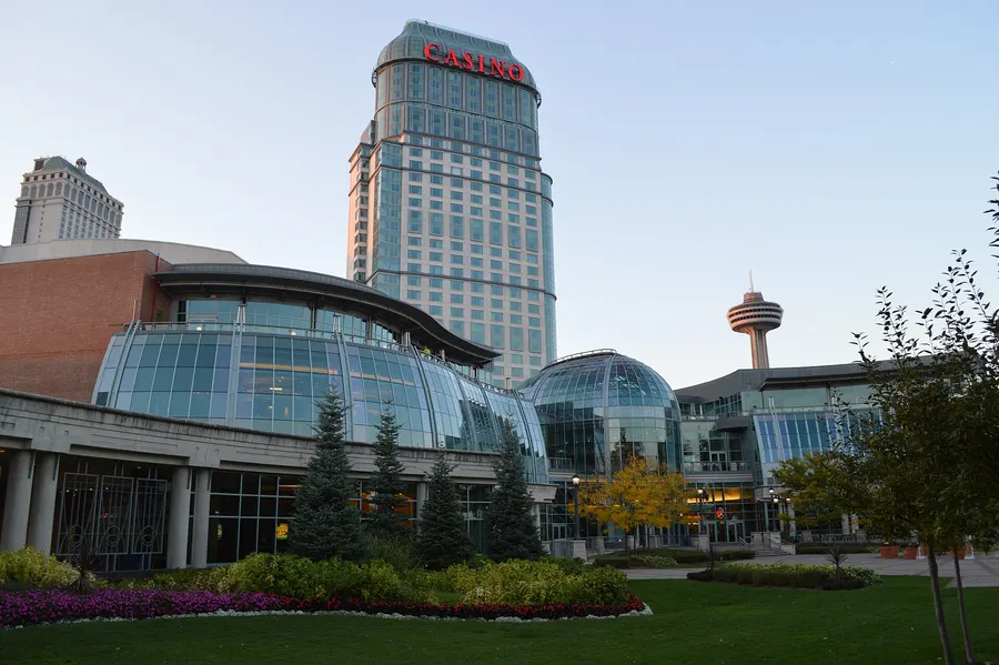 Fallsview Casino Resort by day: the glass-domed casino front and gardens below the hotel tower.